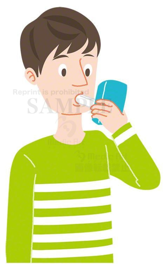 呼気一酸化炭素濃度を測定中の男性